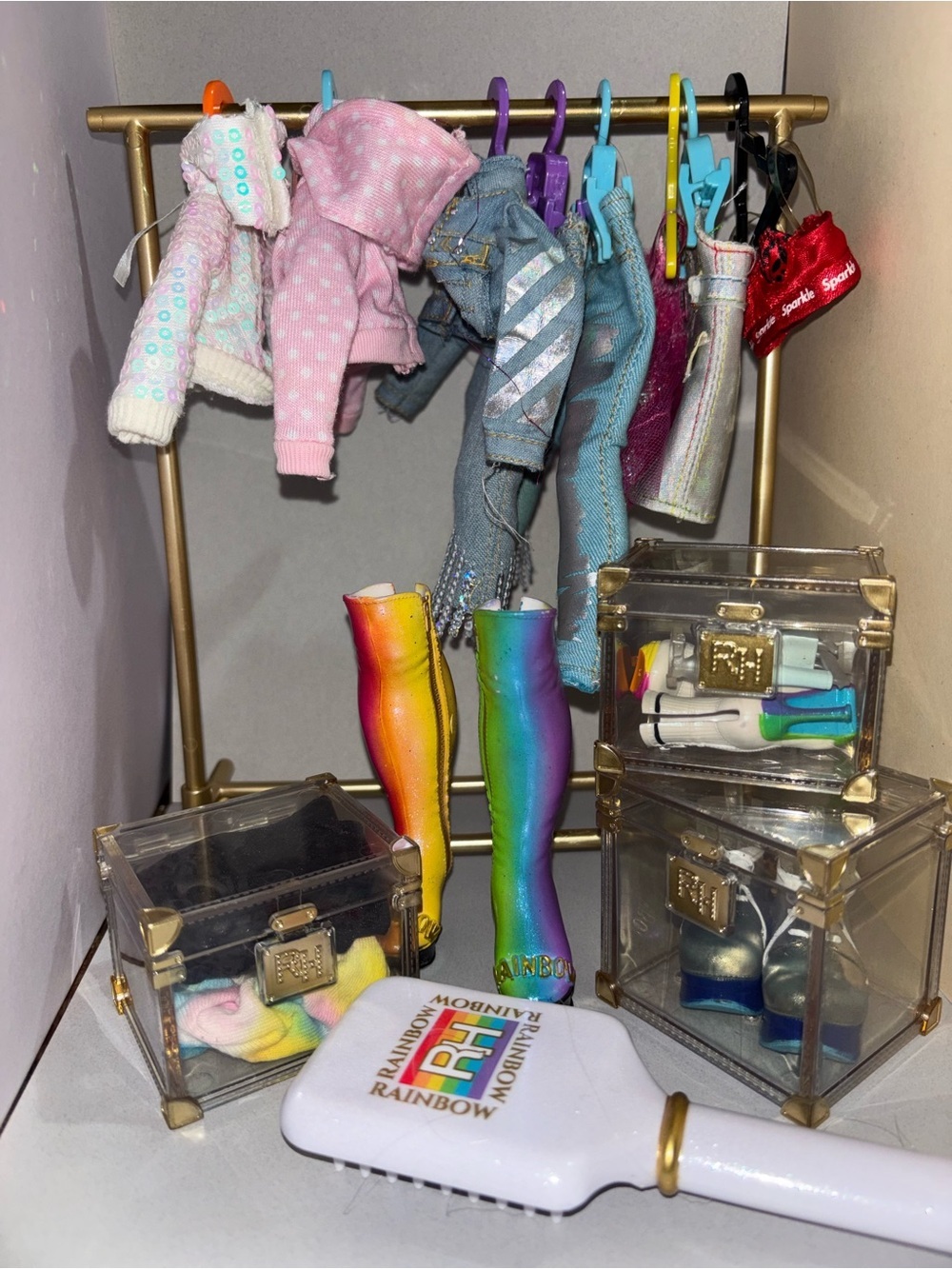 Rainbow high clothing lot with clothing rack and clear acrylic storage cases